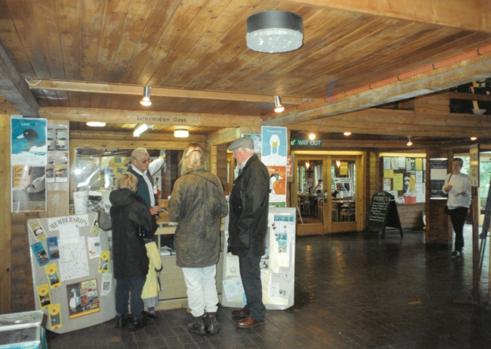 Information desk in the exhibition hall. In the background is the location of the old cafe